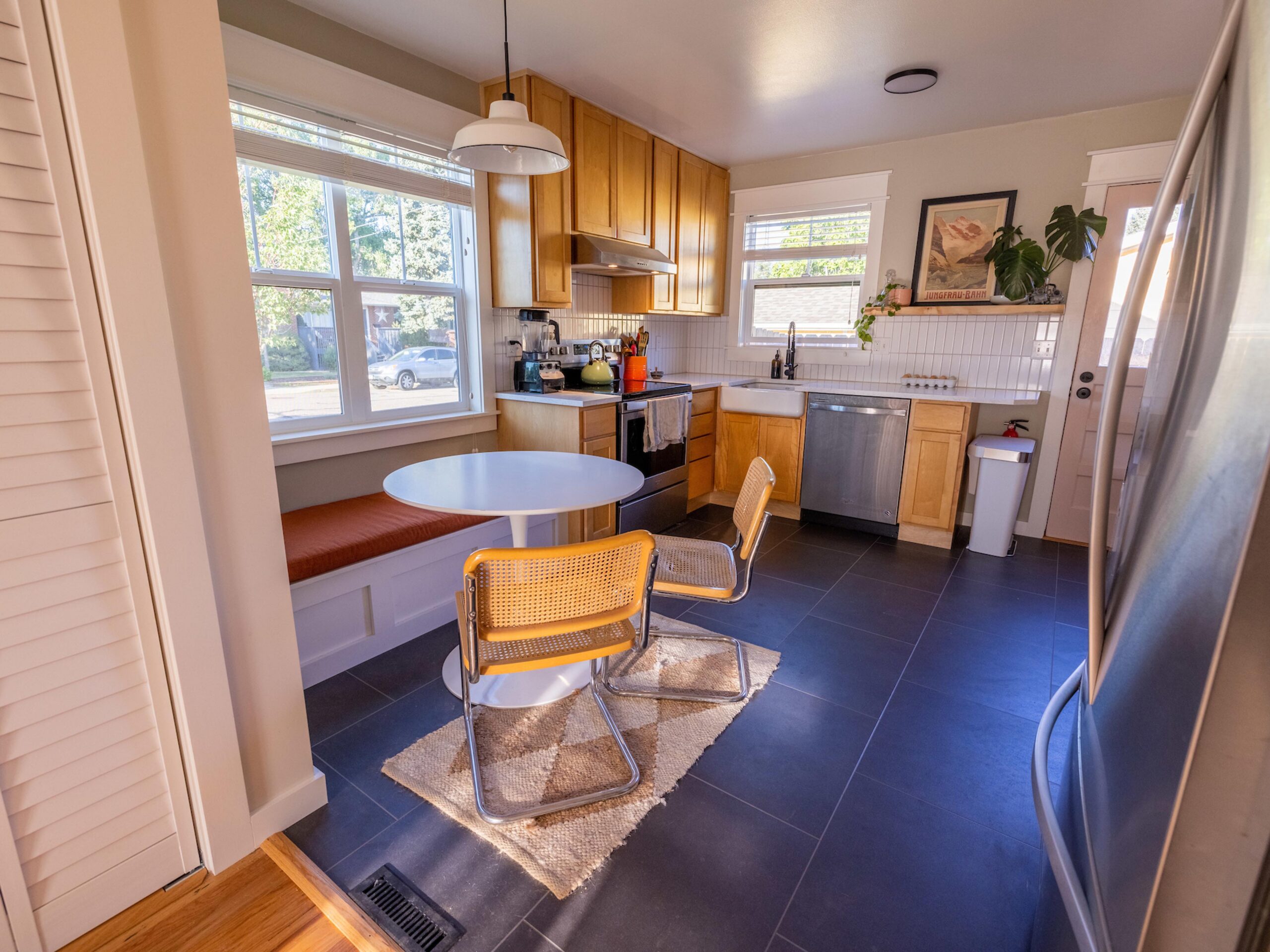 Full kitchen remodel with custom built-in breakfast nook and new windows and floors.