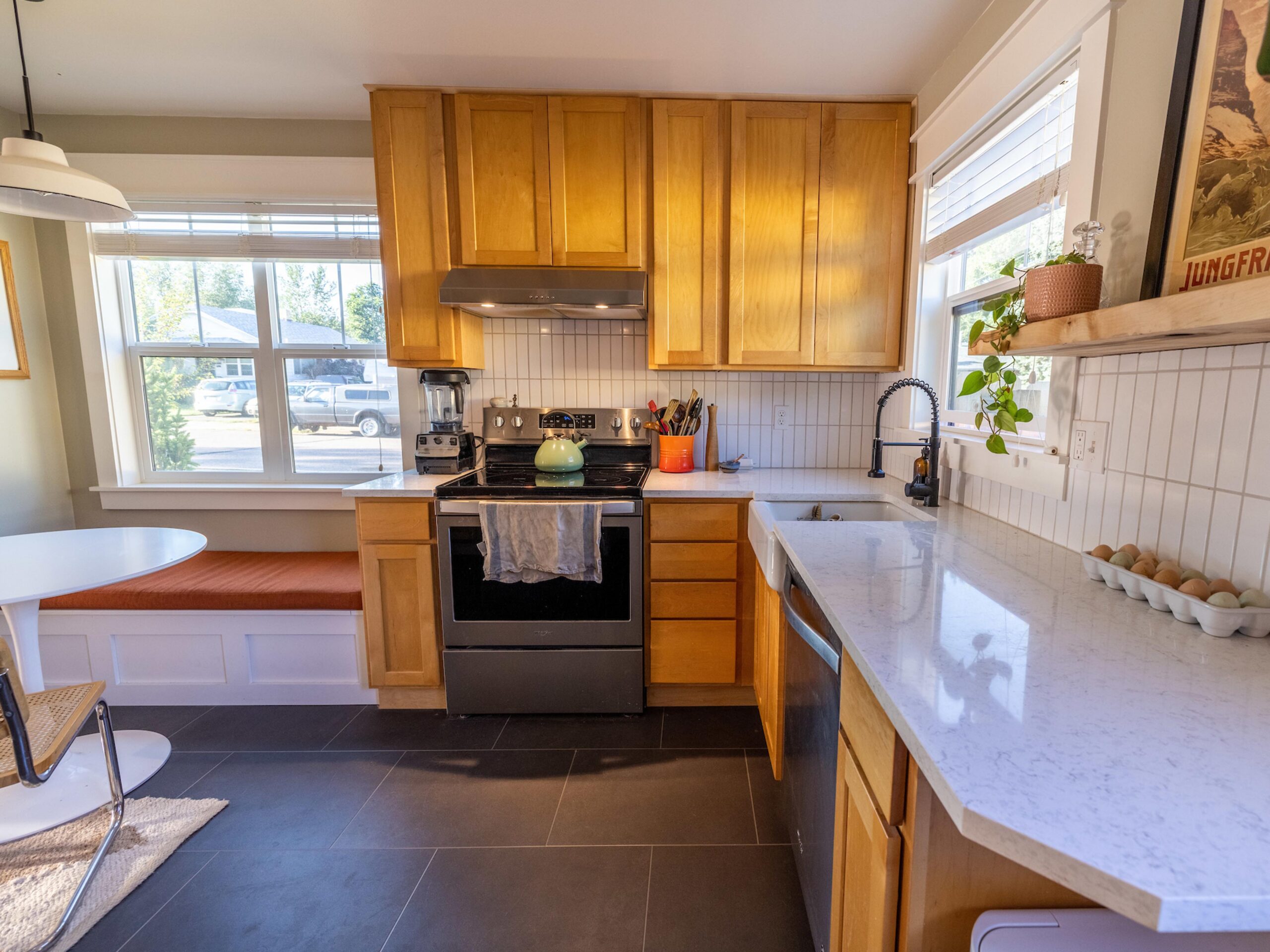Full kitchen gut and remodel with maple cabinets and quartz countertop.
